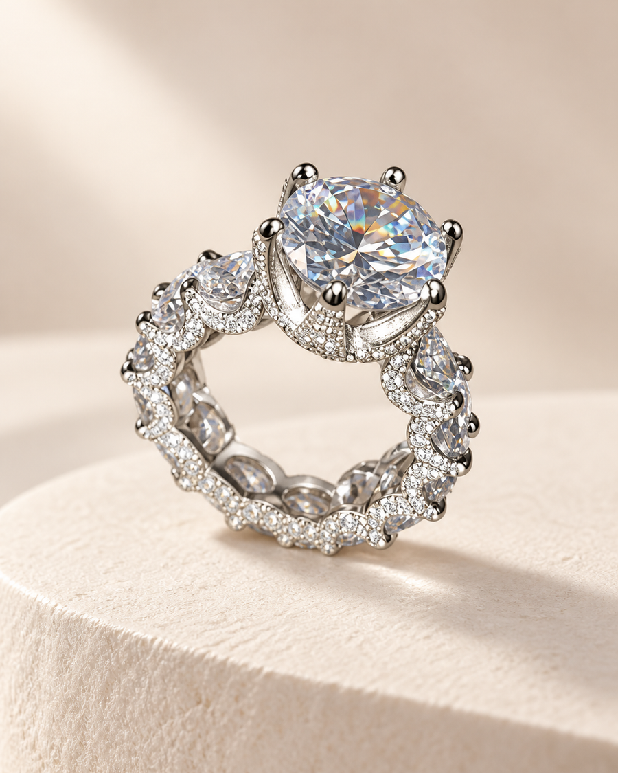 Eternal Brilliance silver ring with a large round stone and pavé-set pear stones on ivory stone